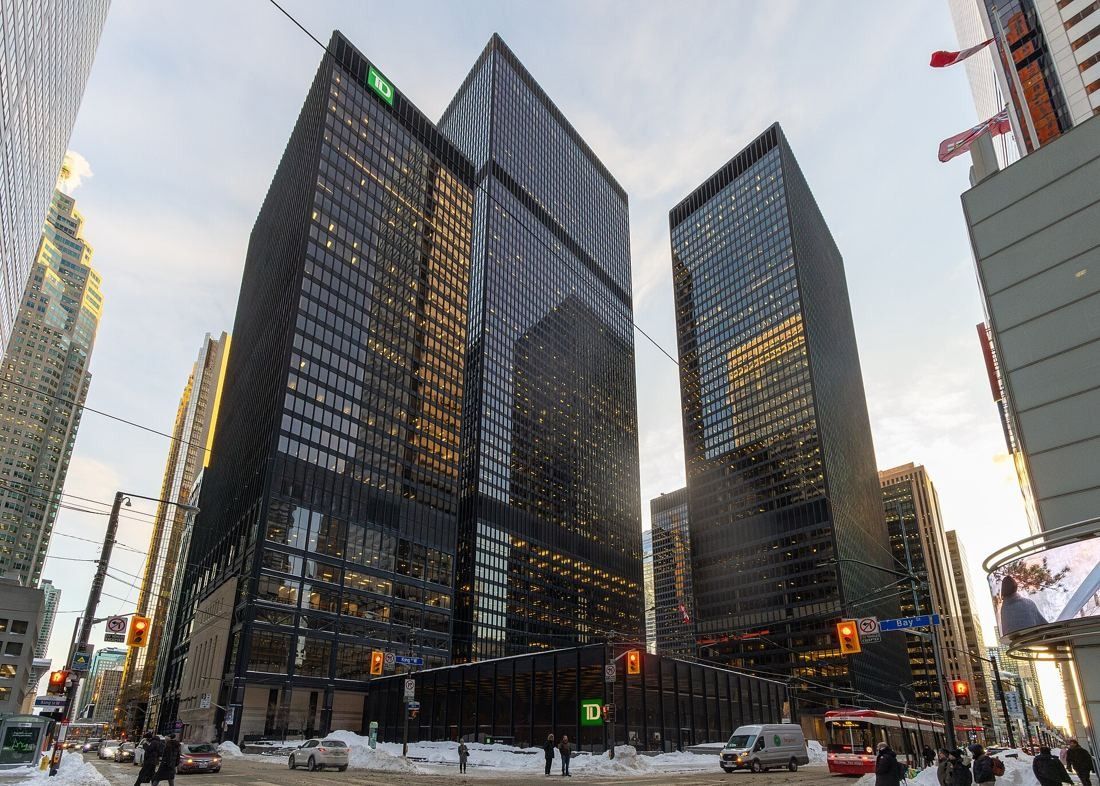 TD Bank Group (The Toronto-Dominion Bank): Black towers at a snowy street intersection in winter