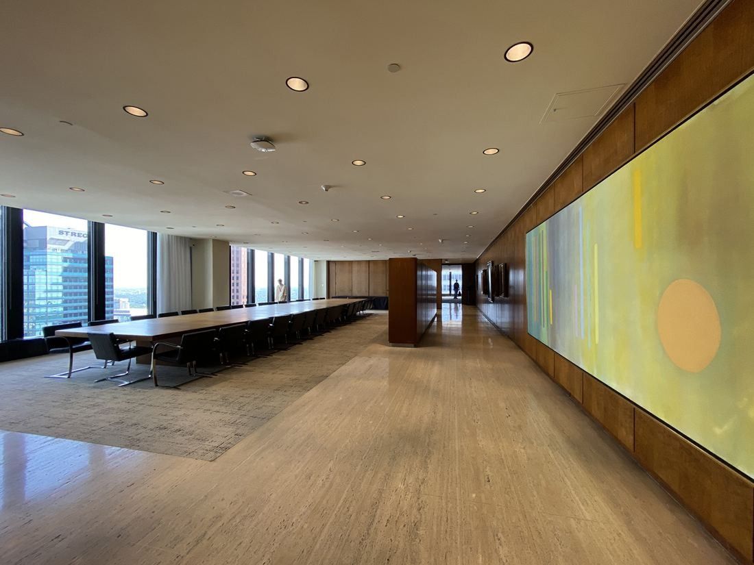 TD Bank Group (The Toronto-Dominion Bank): Long boardroom with a wooden table, wood paneling and a large abstract wall artwork