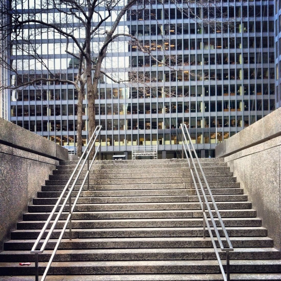 TD Bank Group (The Toronto-Dominion Bank): Stone staircase leading up to a plaza with a black tower behind