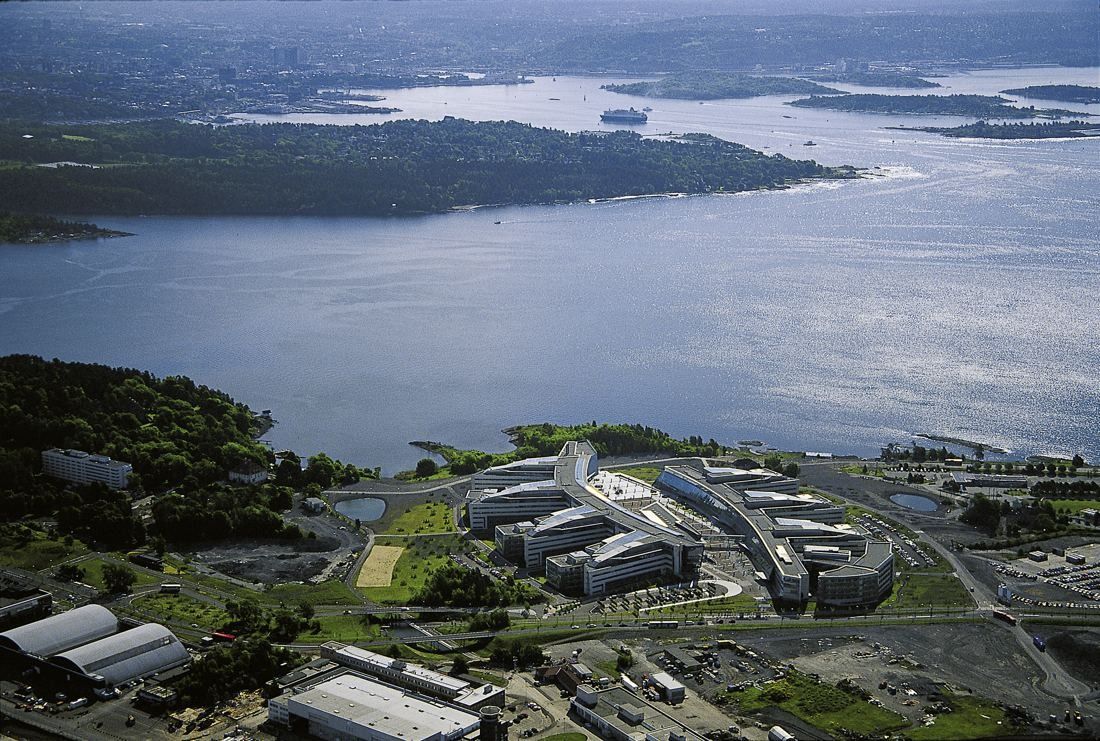 Telenor: Aerial view of the Fornebu peninsula with the office complex and the fjord beyond