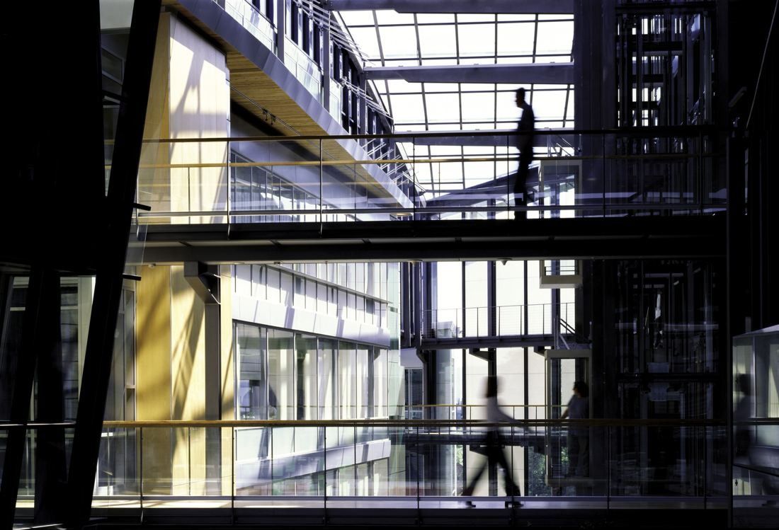 Telenor: Glass bridges crossing between office floors in a tall atrium