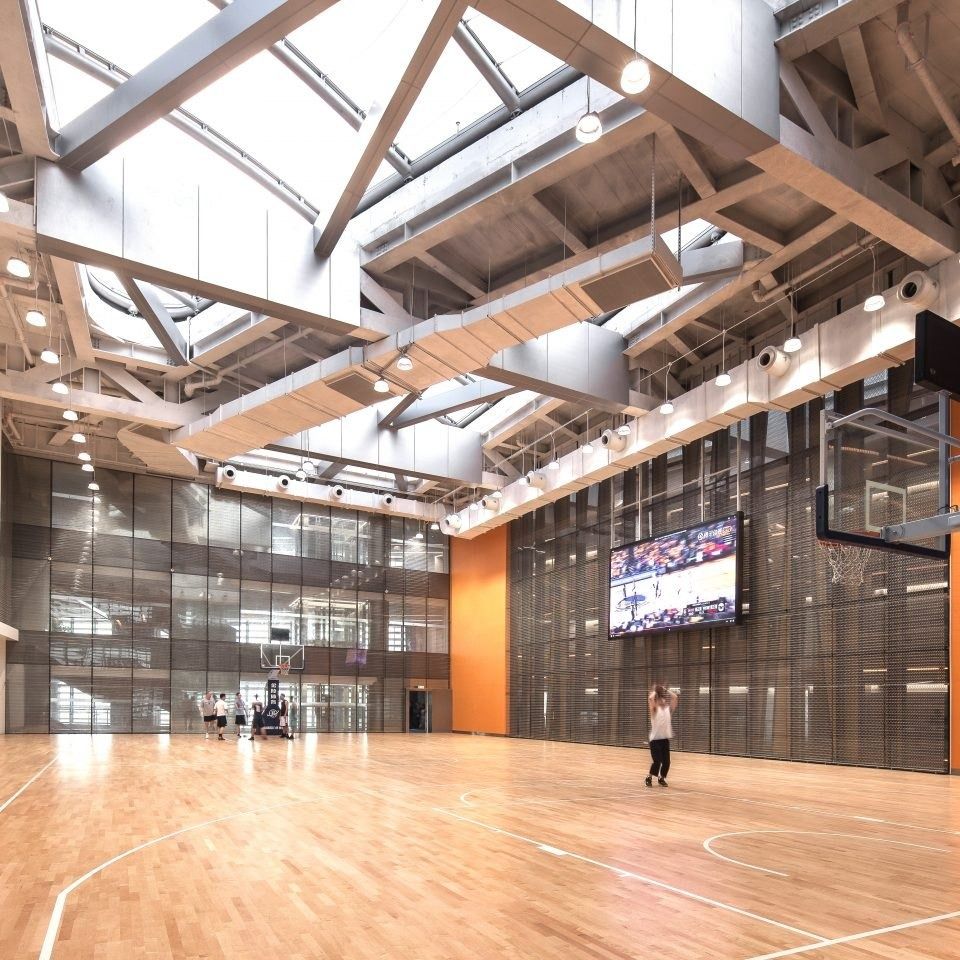 Tencent: Indoor basketball court under a skylit timber roof