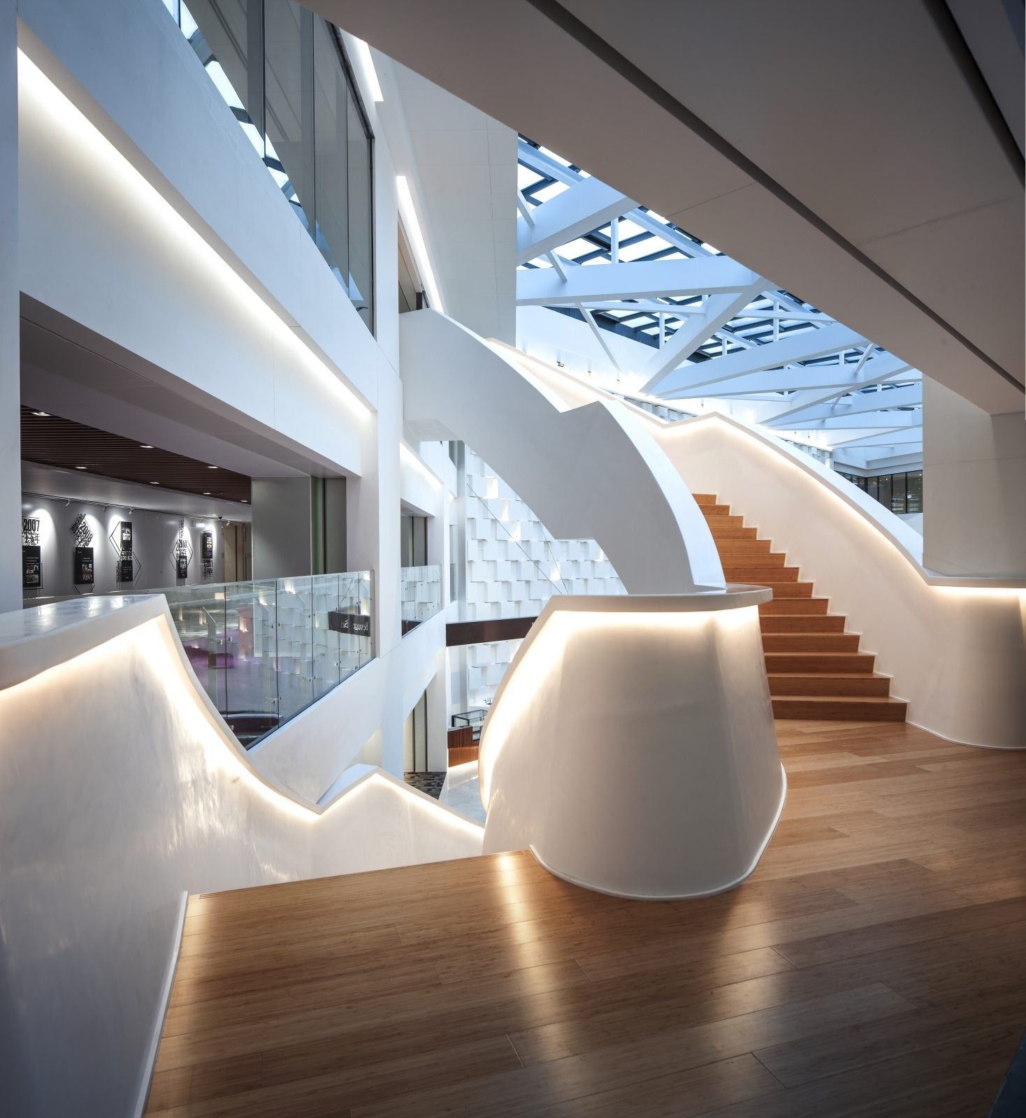 Tencent: Sculpted white staircase in a bright atrium