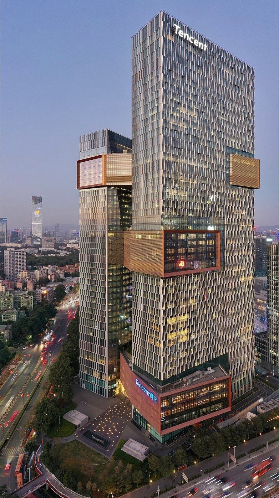 Tencent: The towers at dusk with lights on, seen from above