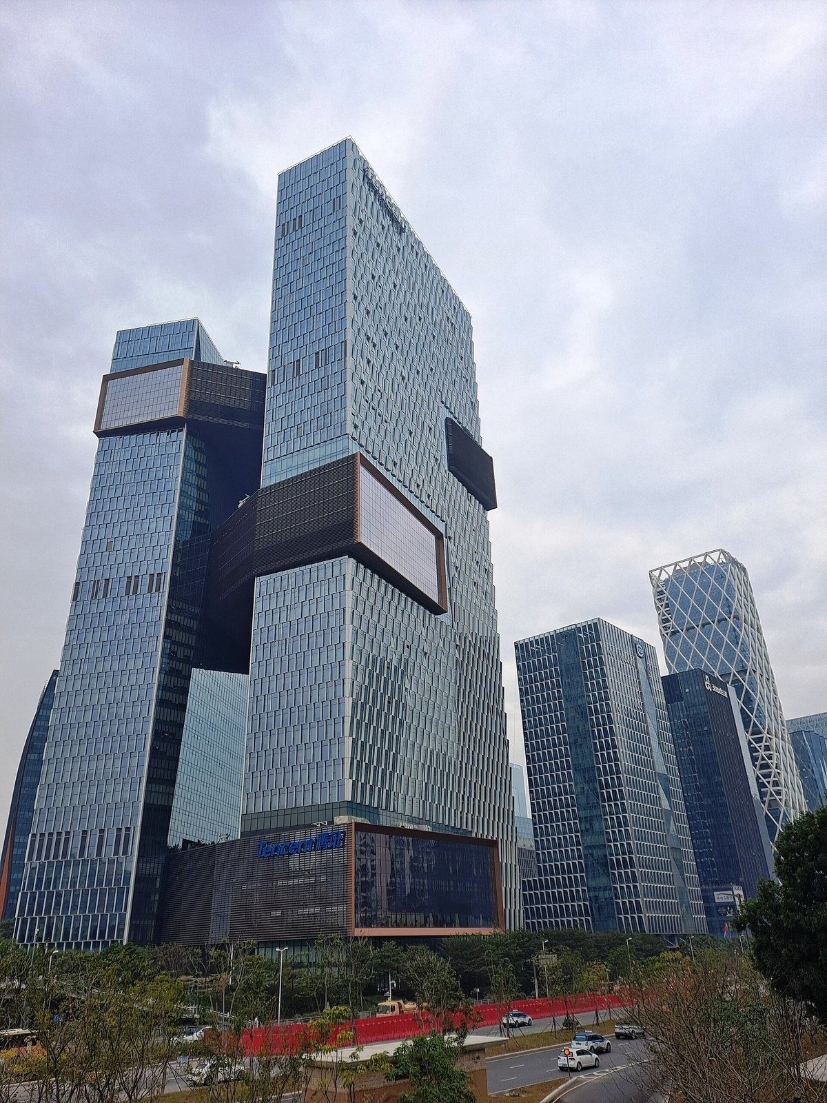Tencent: Two glass towers linked by bridges, seen from below