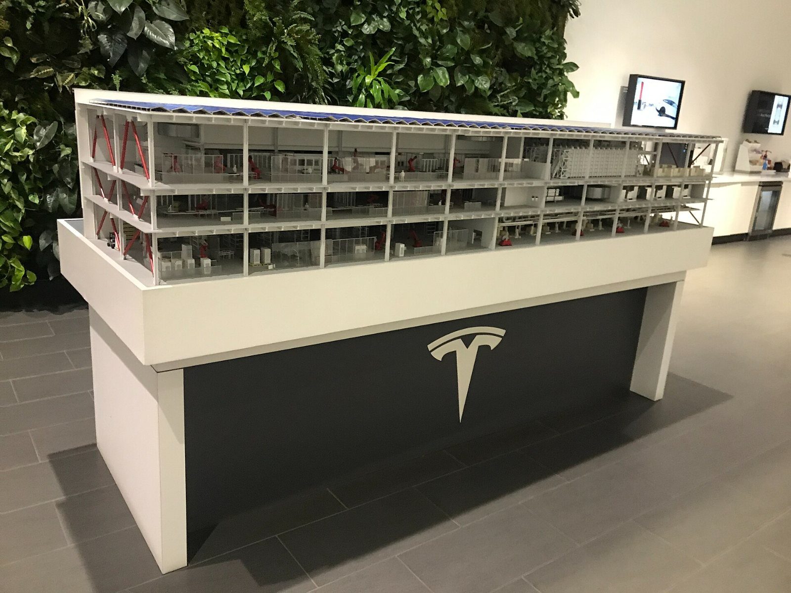 Tesla: Architectural model of a factory on a white plinth