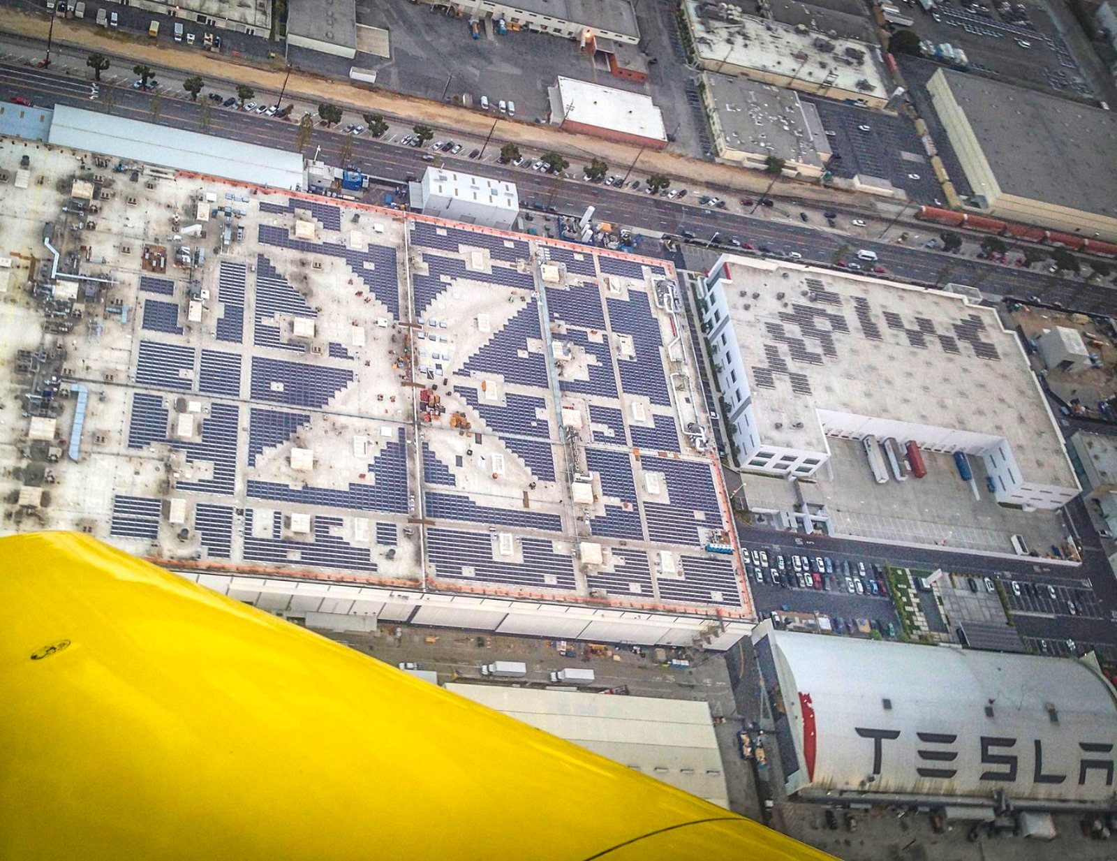 Aerial view of rooftops covered with solar panels