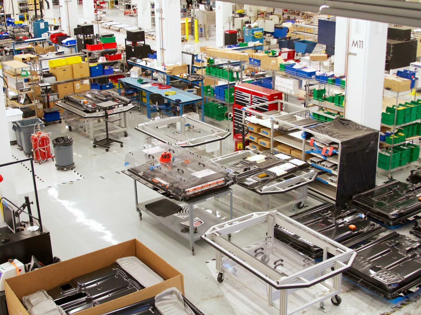 Tesla: Rows of workbenches and parts bins