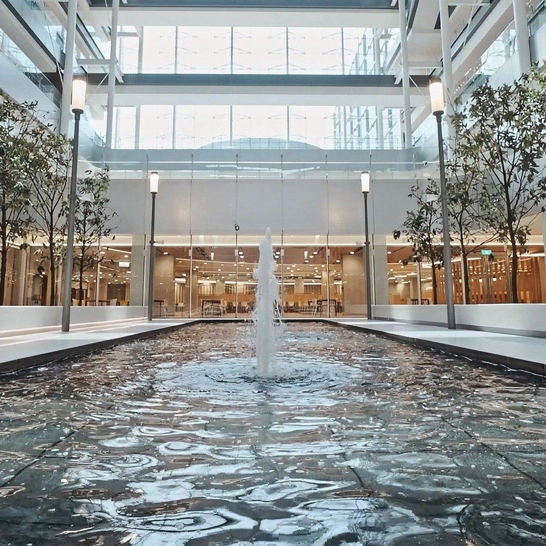 TSMC: A long reflecting pool in a glass-roofed hall
