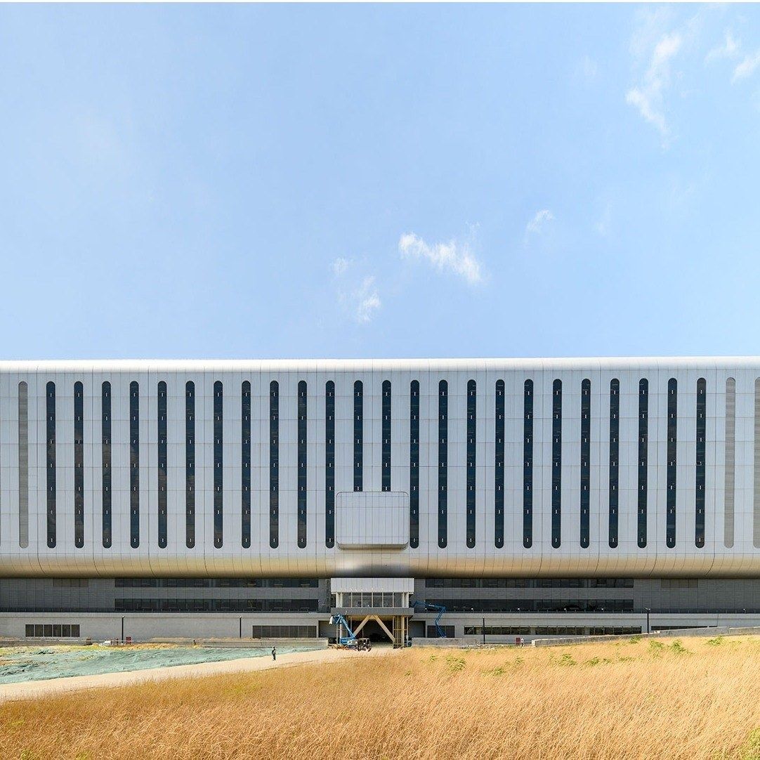 TSMC: Long white building with vertical fins