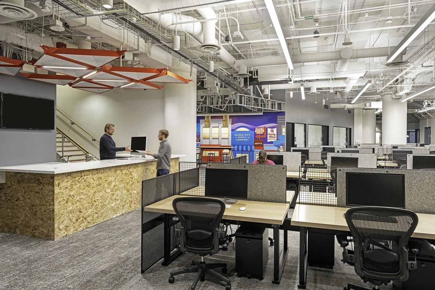 Twilio: Desks next to a reception counter and stair