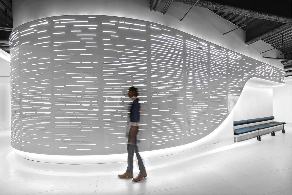 Uber: A curved, backlit perforated wall around the event space
