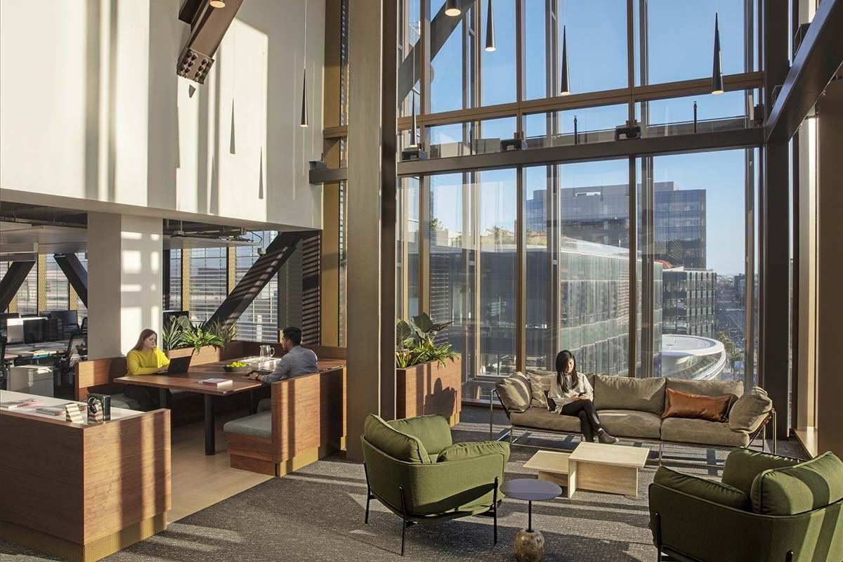Uber: A double-height lounge with green armchairs