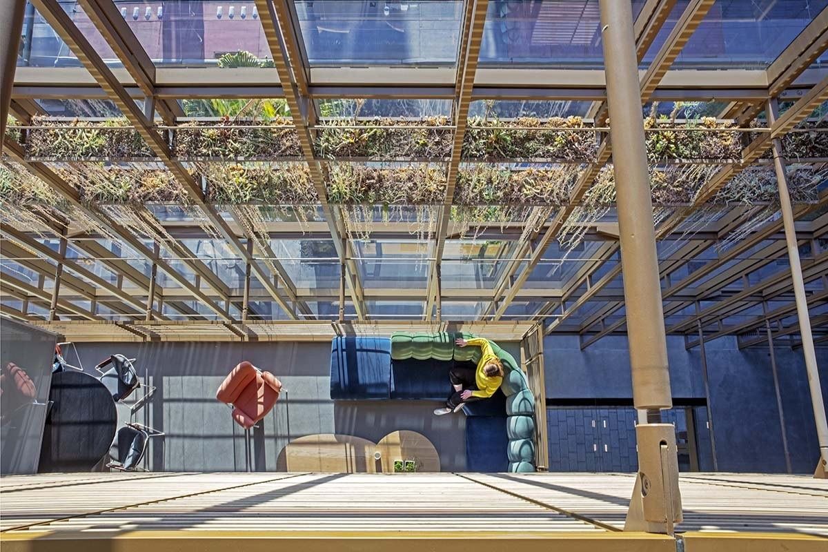 Uber: A glass-roofed terrace with planting overhead