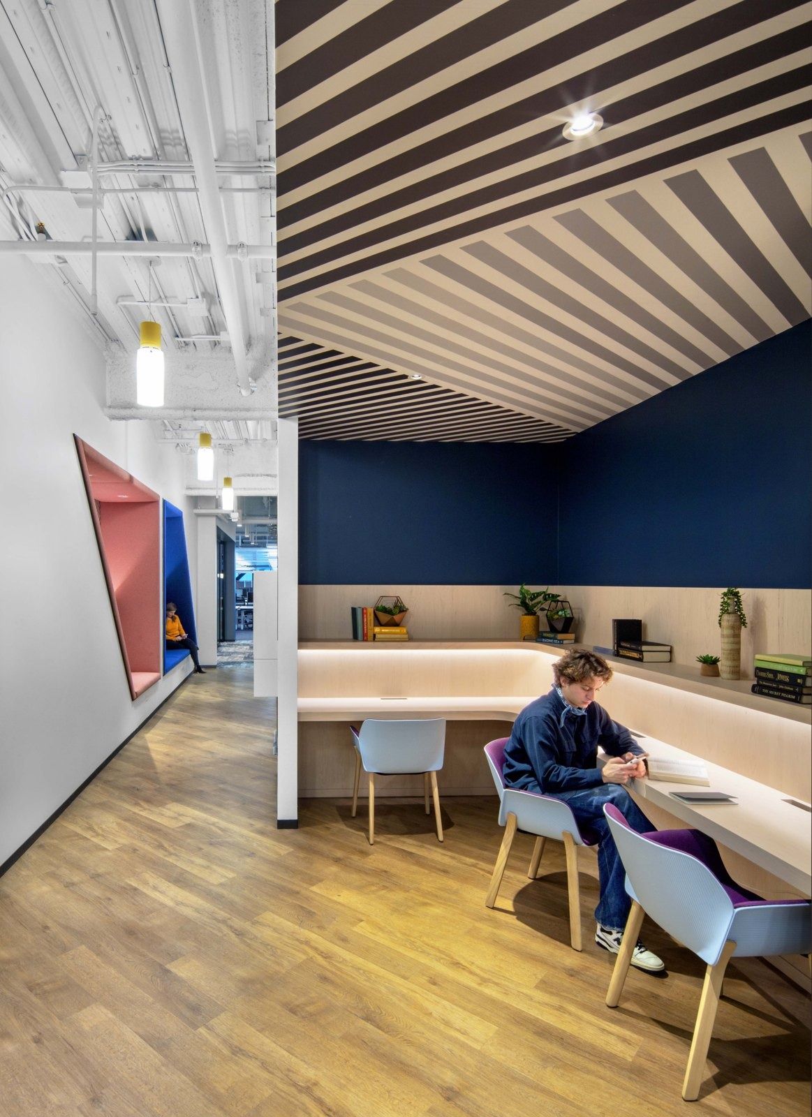 Uber: Small desks under a wood slatted ceiling