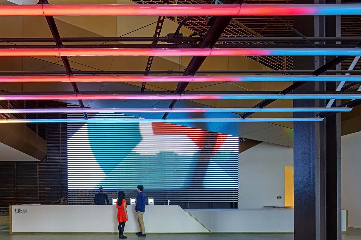 Uber: The 40-foot reception desk under colored light conduits