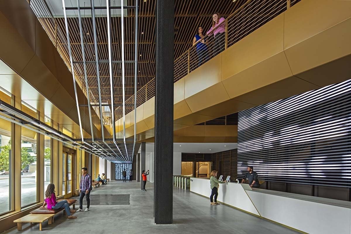 Uber: The double-height lobby with wood slats and a kinetic digital wall