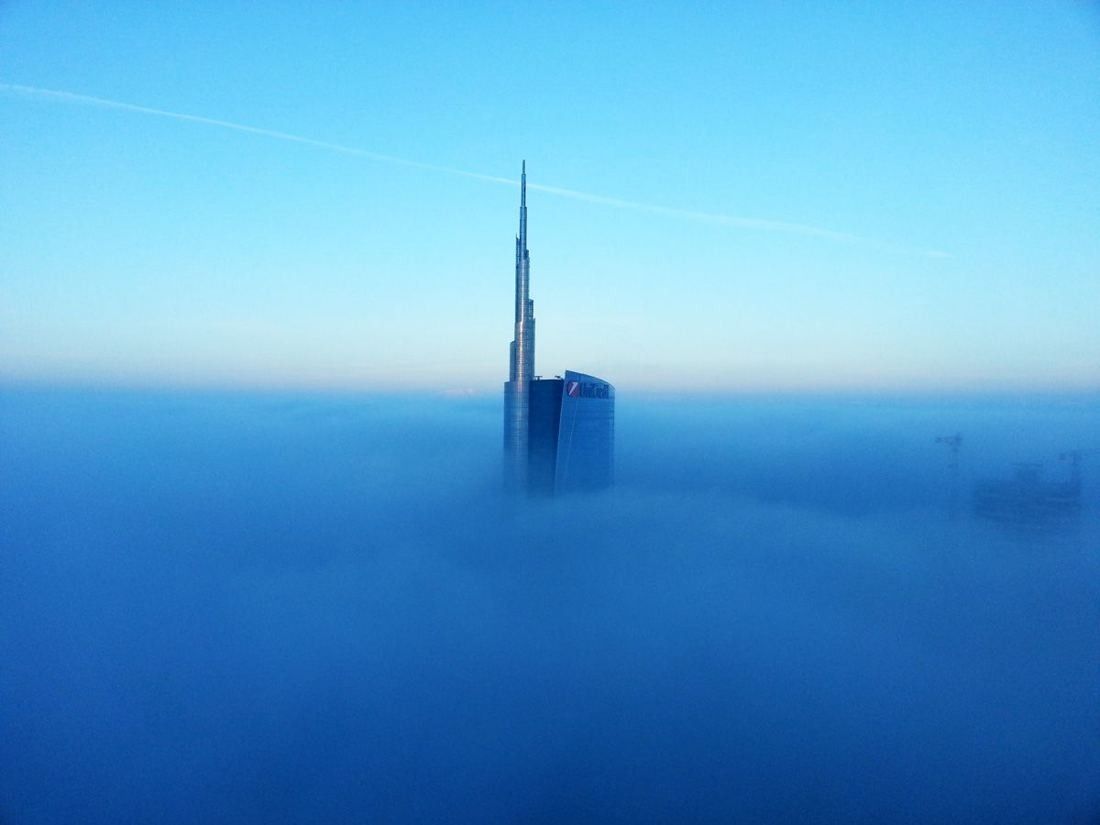 UniCredit: Tower spire rising above a layer of fog