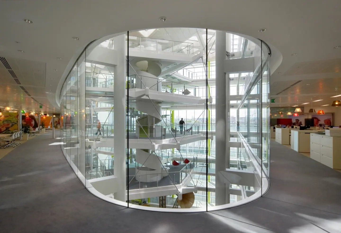Unilever: Glass-enclosed spiral stair on an open office floor
