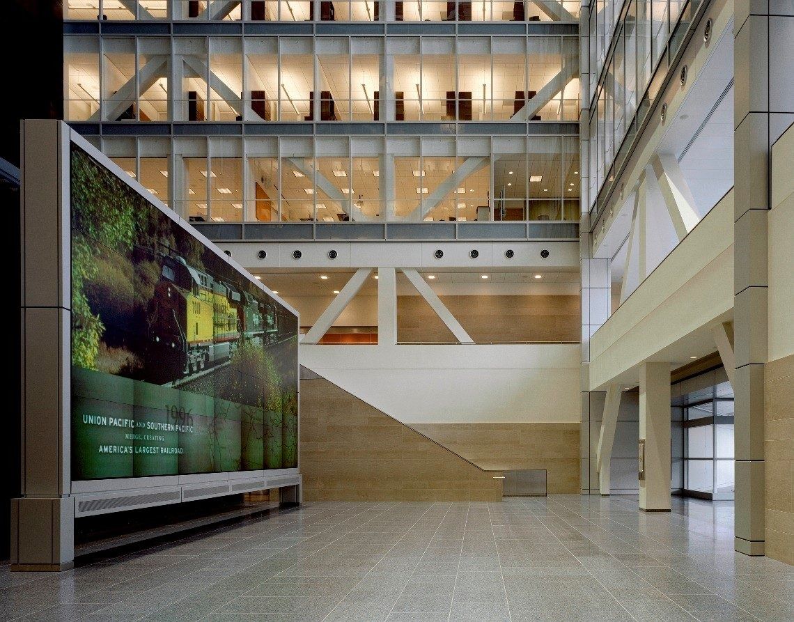 Union Pacific: Tall atrium with a large green wall graphic and stairs