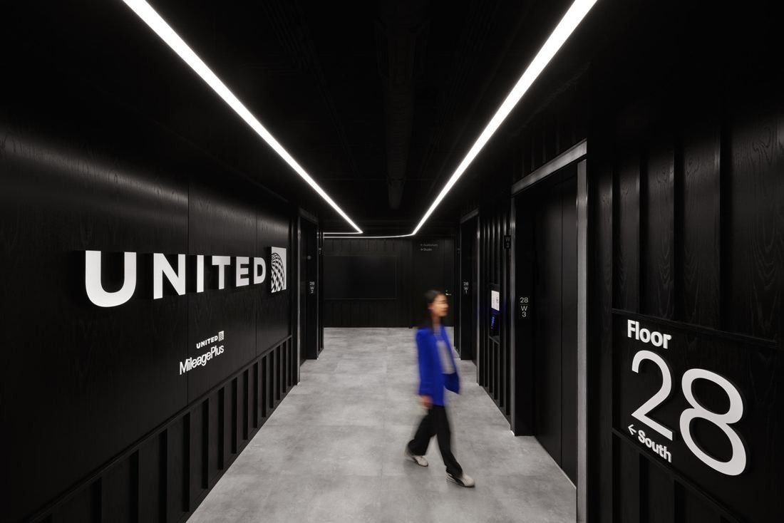 United Airlines: Black elevator lobby with a white UNITED sign and a large Floor 28 marking