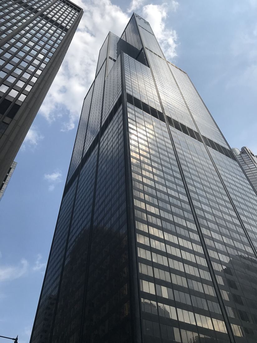 United Airlines: Steep upward view of the black glass and steel facade of Willis Tower