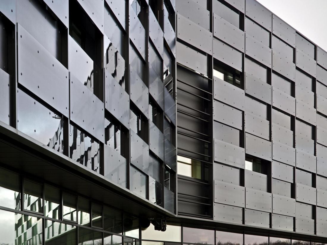 Vestas: Close view of a façade of dark glass panels set at different depths