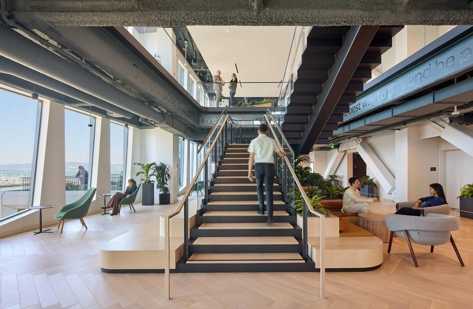 Visa: A dark steel stair between floors