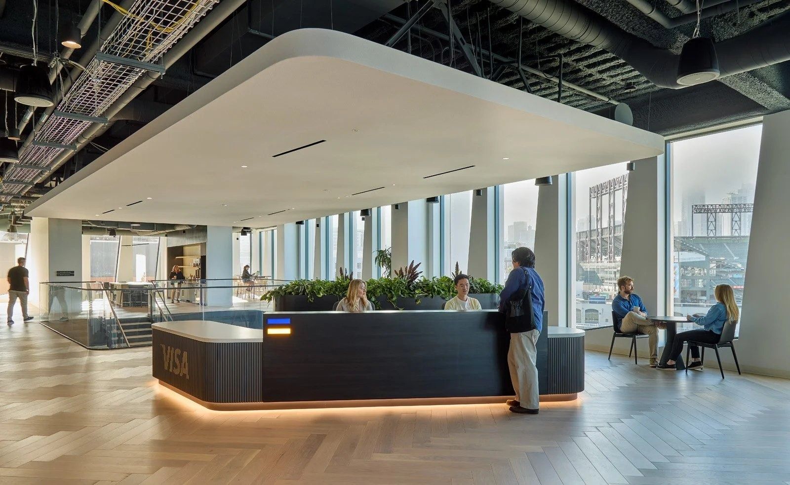 Visa: A reception desk by tall windows