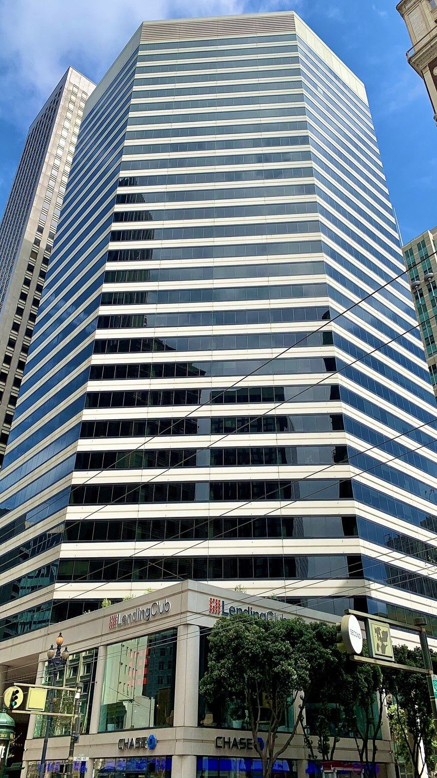 Tall striped glass tower at 595 Market Street