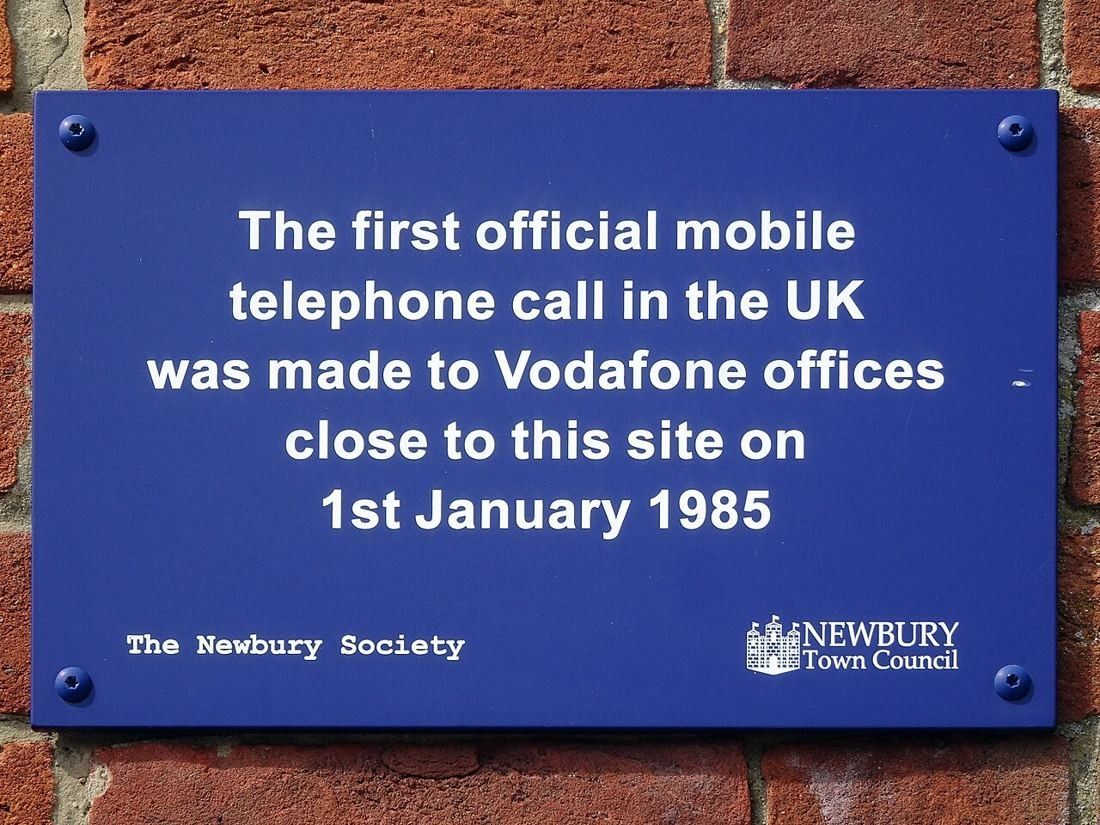 Blue plaque marking the first official UK mobile call made to the nearby Vodafone offices