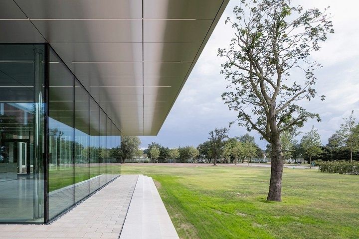 Volkswagen Group: Glass wall under a canopy facing a park