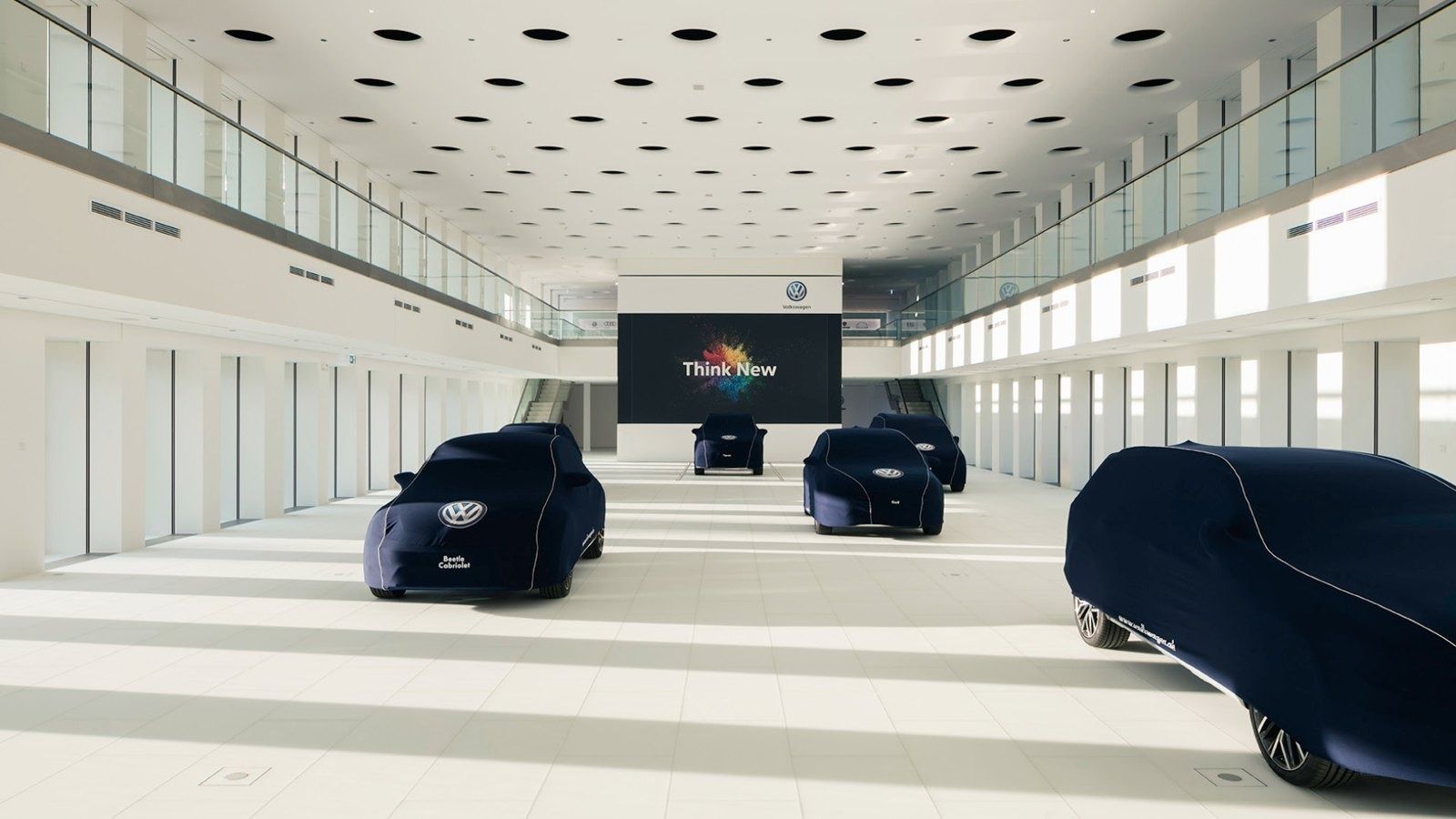 Volkswagen Group: Long hall with cars under covers
