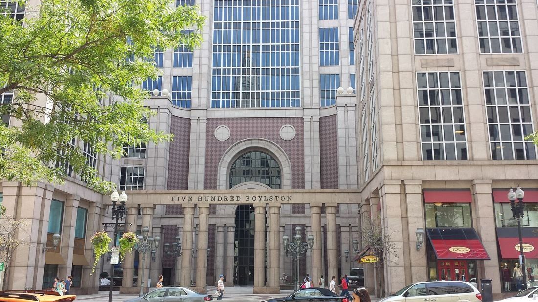 Wayfair: Stone and glass office tower with an arched entrance and the words Five Hundred Boylston above the colonnade