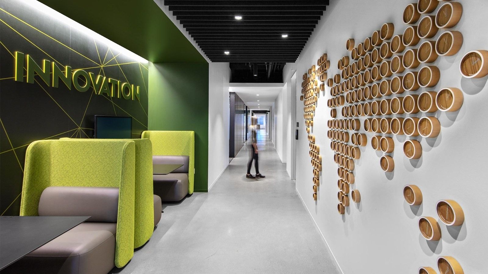 Western Union: A corridor with green booths and a map of wooden discs