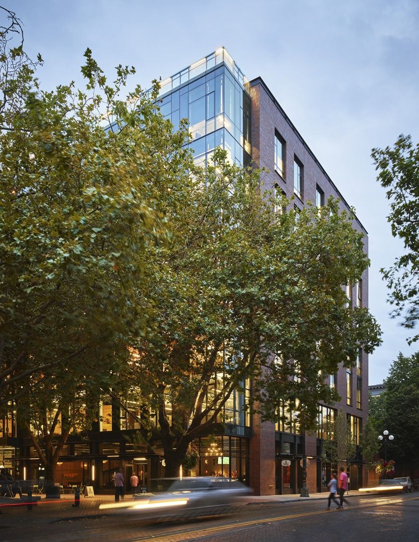 Weyerhaeuser: Building corner behind tall trees