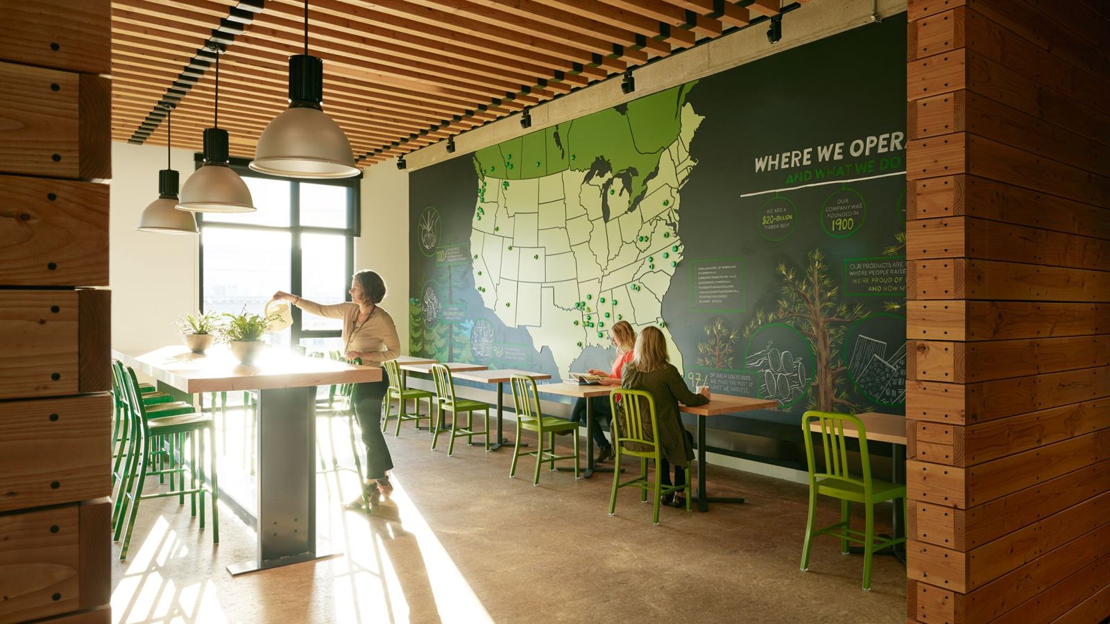 Weyerhaeuser: Café with green chairs and a large map of where Weyerhaeuser operates
