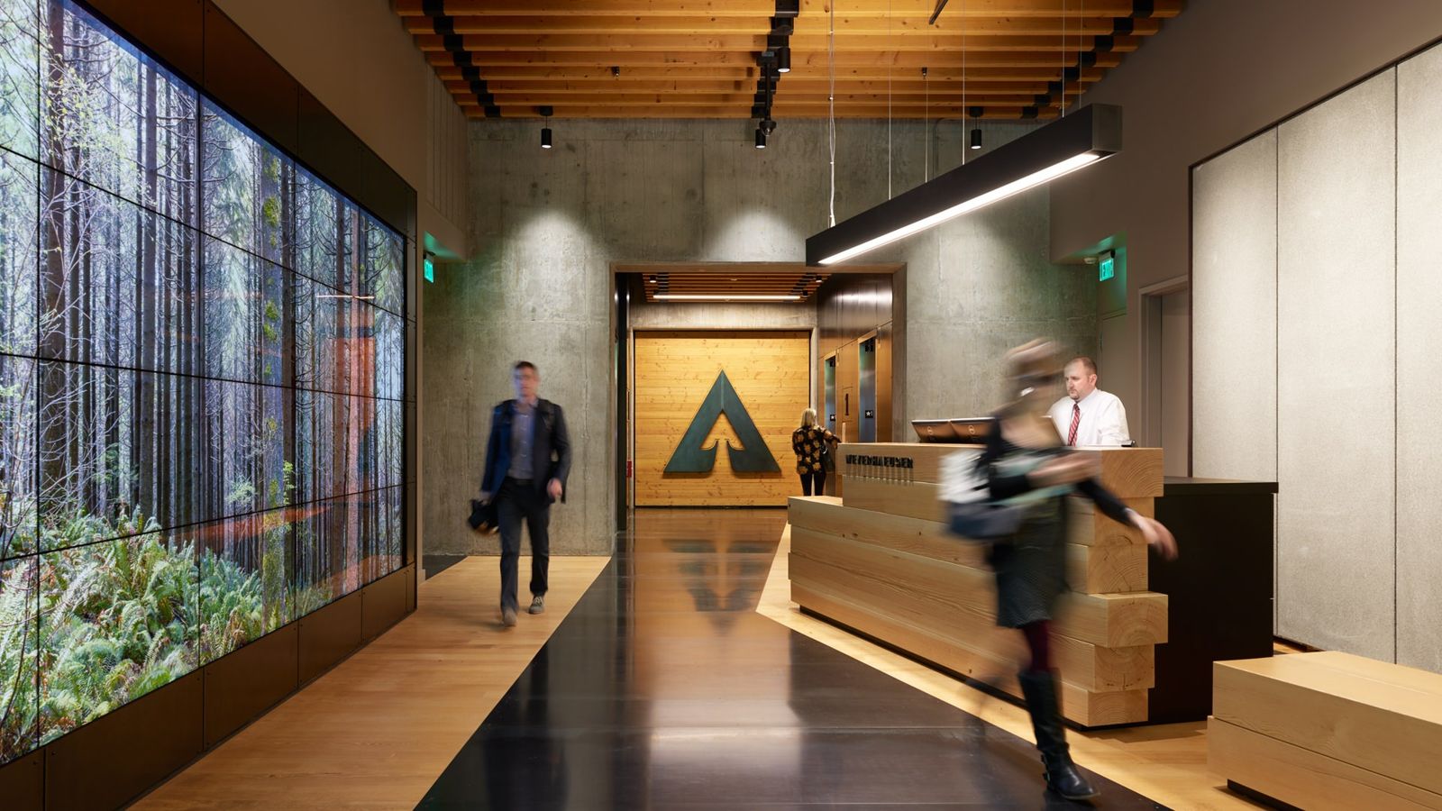 Weyerhaeuser: Lobby with a forest video wall and a wooden reception desk