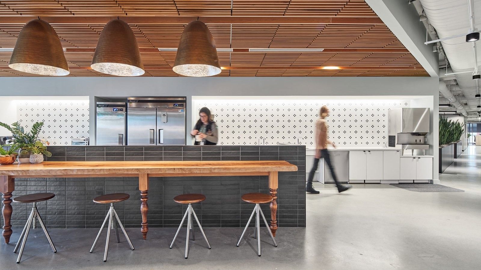 Whole Foods Market: A kitchen counter with copper pendant lights