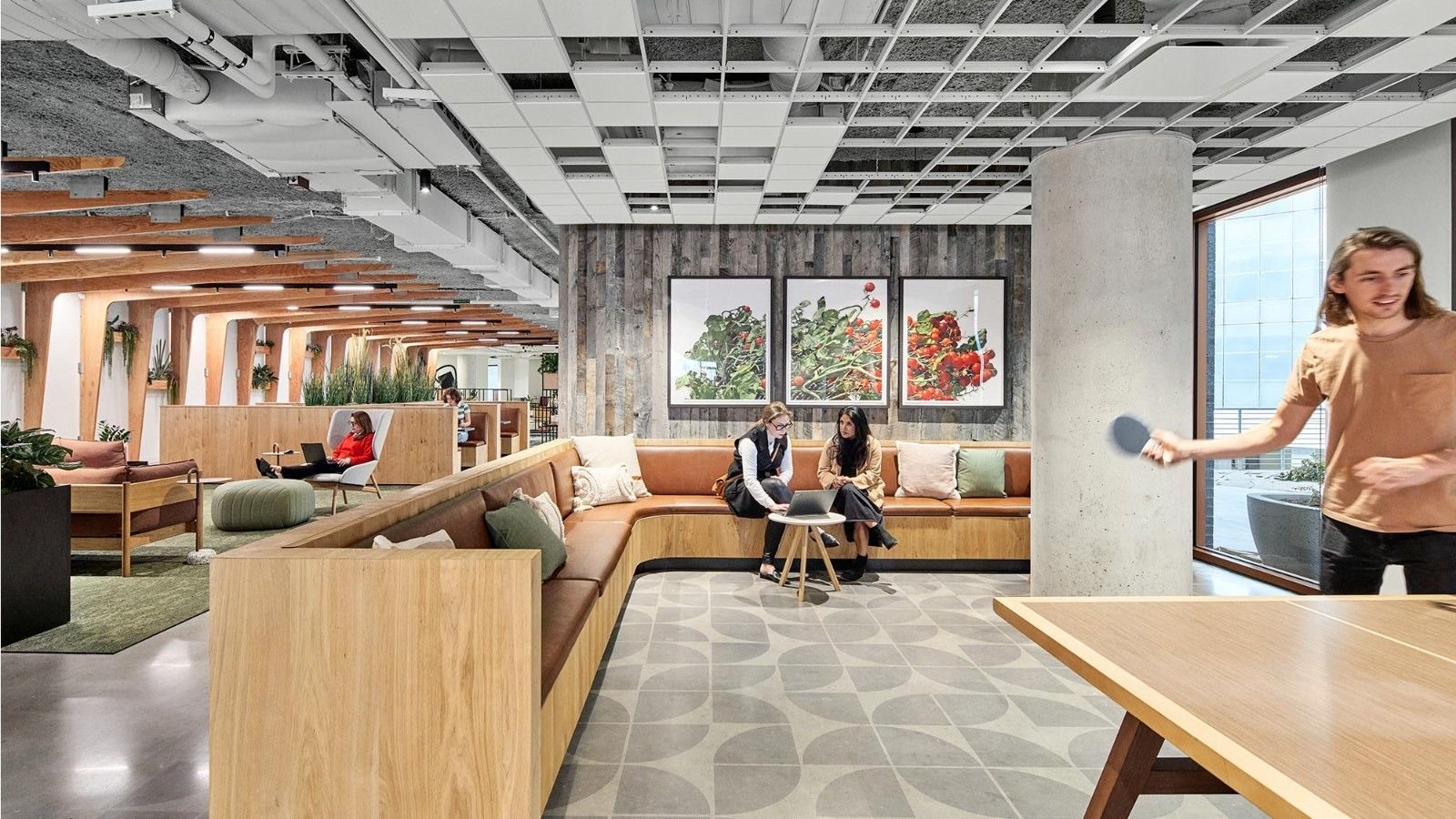 Whole Foods Market: A lounge with green banquettes and a long wooden table