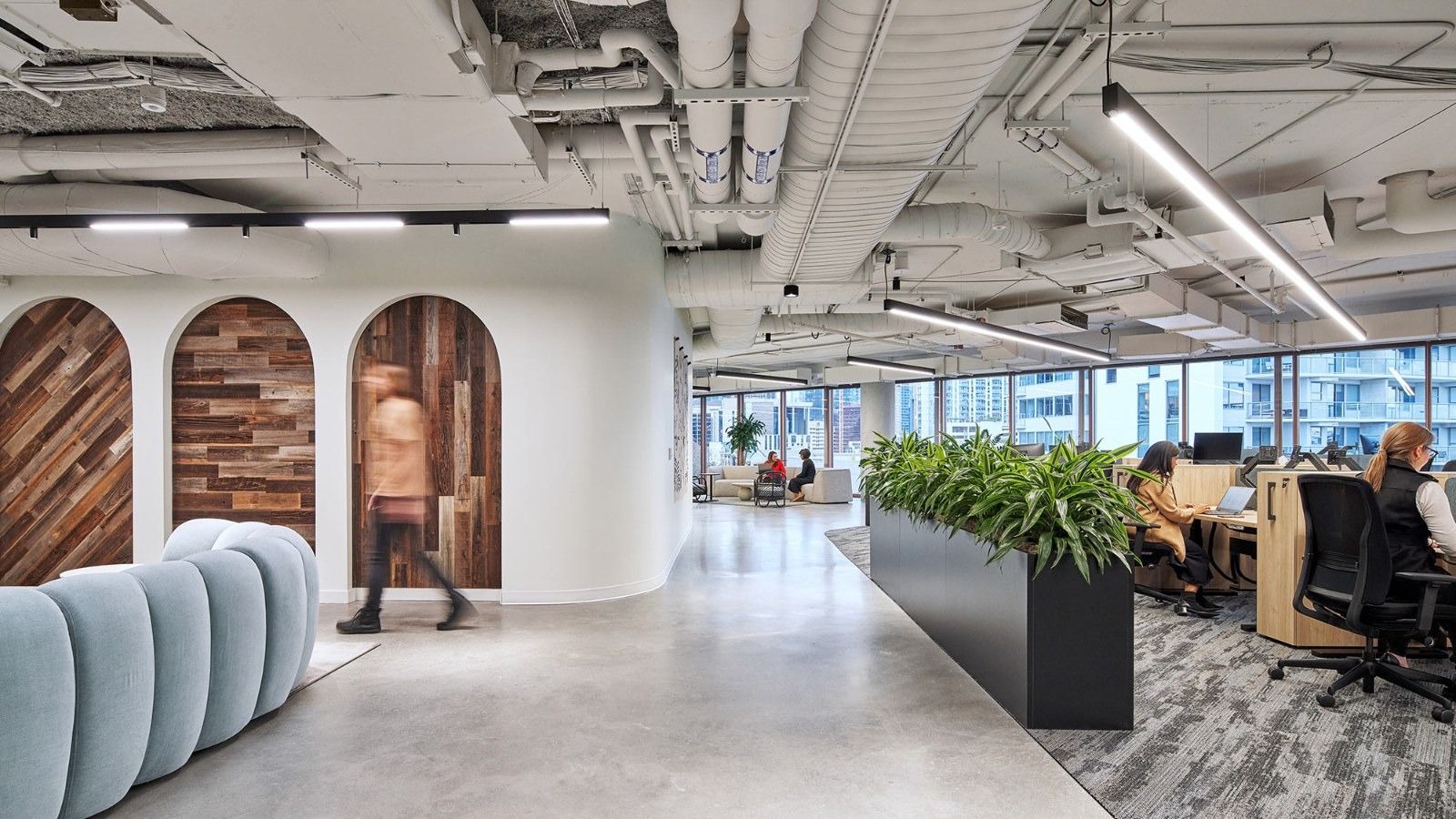 Whole Foods Market: Arched doorways and planters beside open desks