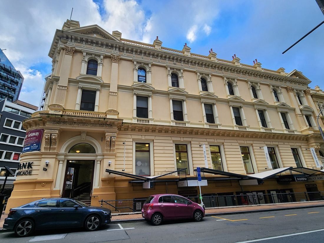 Ornate cream Victorian bank building seen from Customhouse Quay