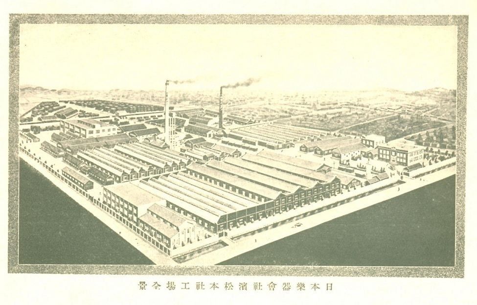 A printed bird's-eye view of a large factory complex with long sawtooth-roofed sheds and smokestacks