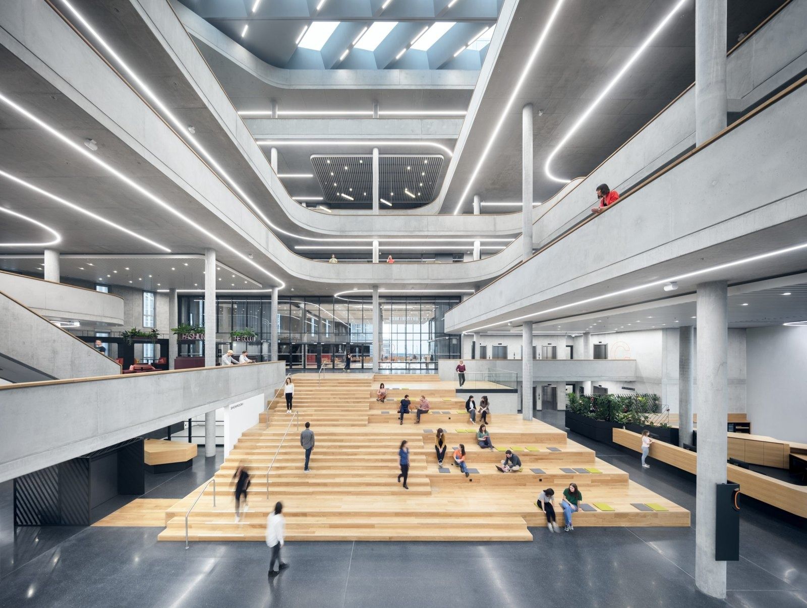 Zalando: Long view of the atrium with bleacher steps, galleries and skylights