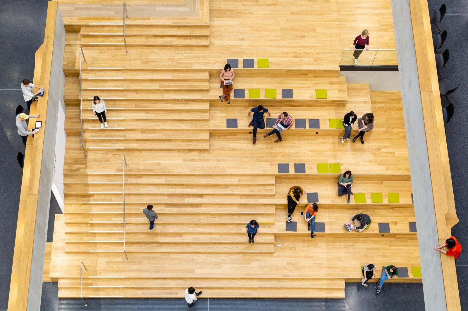 Zalando: Top-down view of wide wooden steps with scattered cushions
